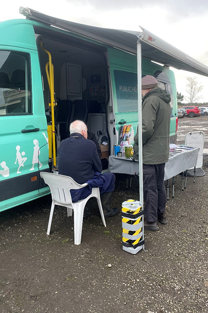 Health and Wellbeing Support Project table and van at event